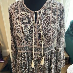 Boho pullover top with ties front.